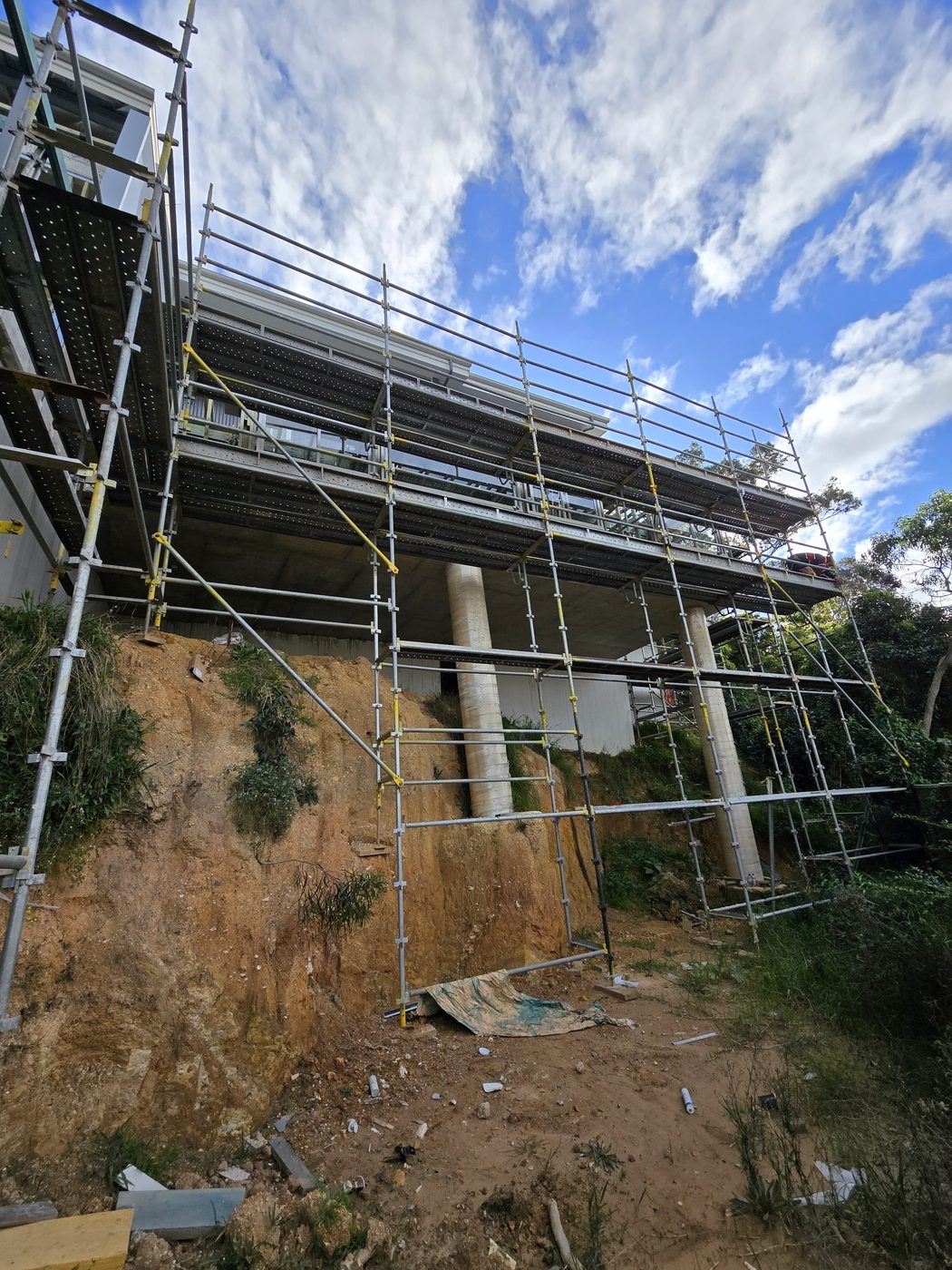 Underslung scaffold access beneath a bridge