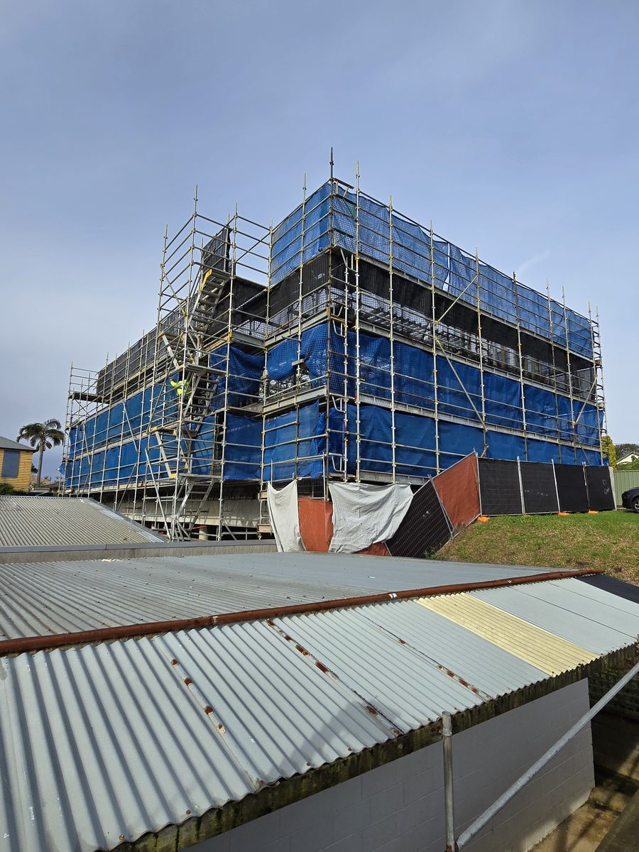 Commercial building wrapped in containment